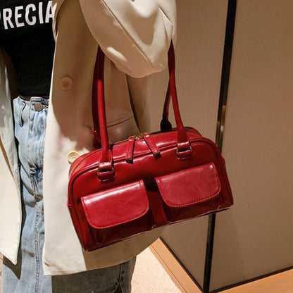 Sac à bandoulière multi-poches pour femme.