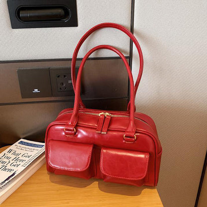 Sac à bandoulière multi-poches pour femme.